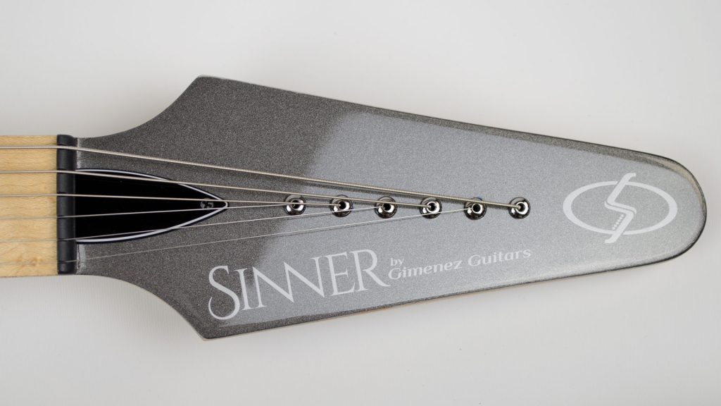 metallic silver headstock of a Gimenez Guitars Sinner